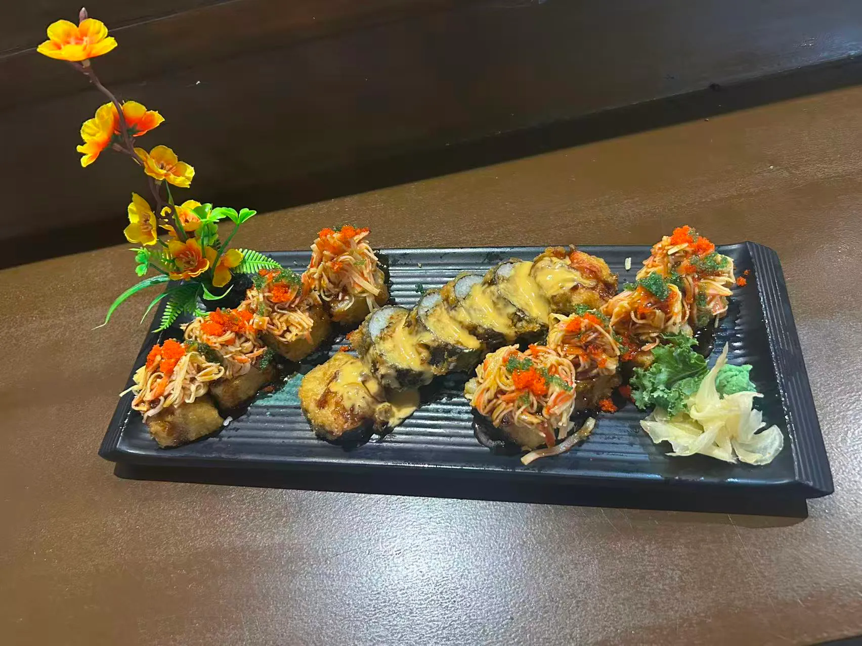 Platter of crispy tempura sushi rolls topped with fish roe and shredded veggies at Sakura Sushi Restaurant, a Japanese Restaurant in Live Oak
